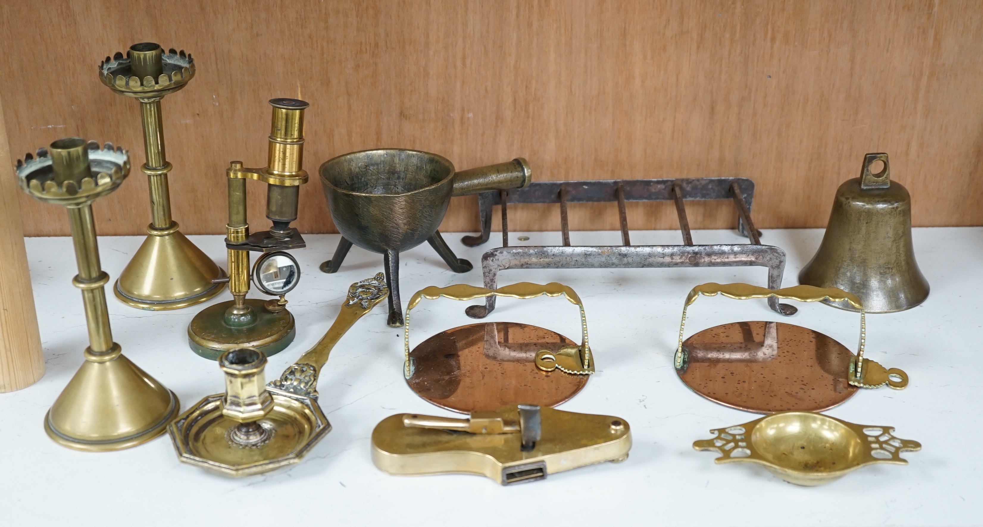 Metalware: to include 19th century vein-cutter, a pair of candlesticks, a candle holder, quaich etc., candlesticks 16cm high (11). Condition - fair